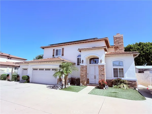 front view of a house with a yard