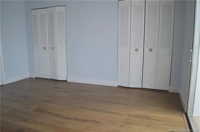 a view of a swimming pool with a yard and a fountain