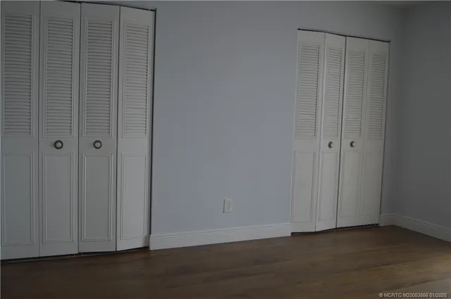 a view of a kitchen with furniture and a large window