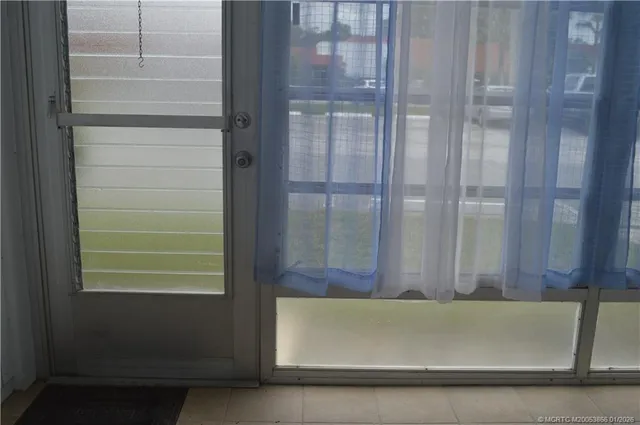 a view of a livingroom with furniture and staircase