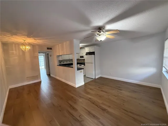 a view of a kitchen with electric appliances