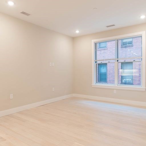 197 Green Street, Unit 202 Boston, MA 02130 - Photo 6 of 8 an empty room with a window