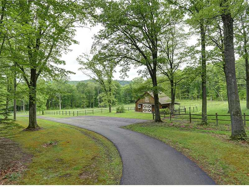 250 Weaver Mill Road Rector, PA 15677 - Photo 22 of 24 Land. Driveway from house past the barn and pastures