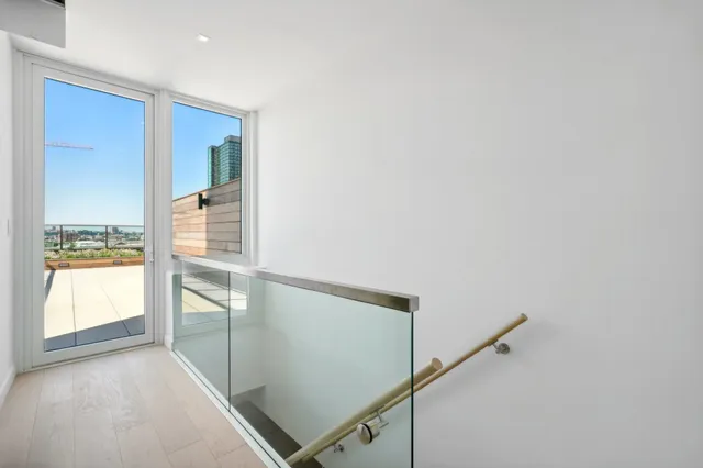 a view of entryway with wooden floor