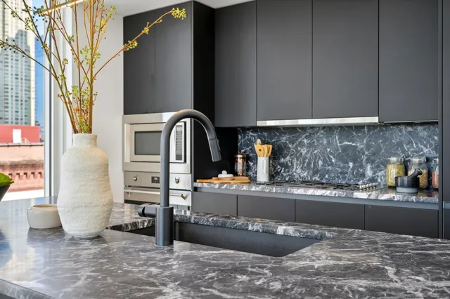 a kitchen with a sink and a refrigerator
