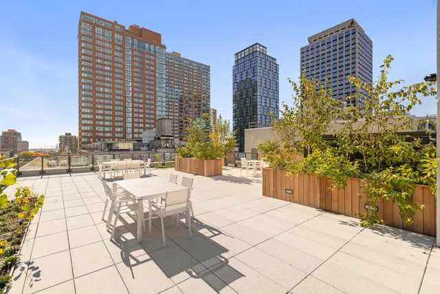 a view of terrace with seating space and trees