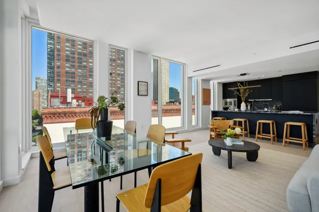 a dining room with furniture and wooden floor