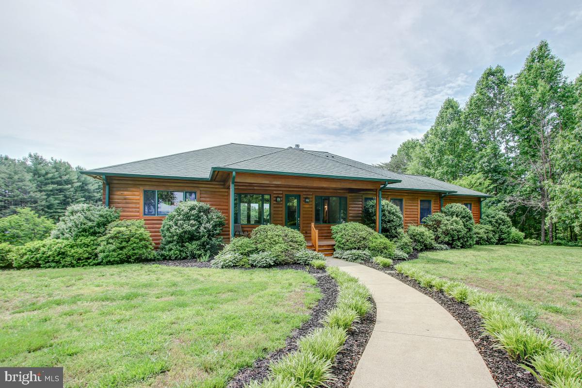 9626 Sherburne Farm Road Marshall, VA 20115 - Photo 1 of 57 a front view of a house with a yard and trees