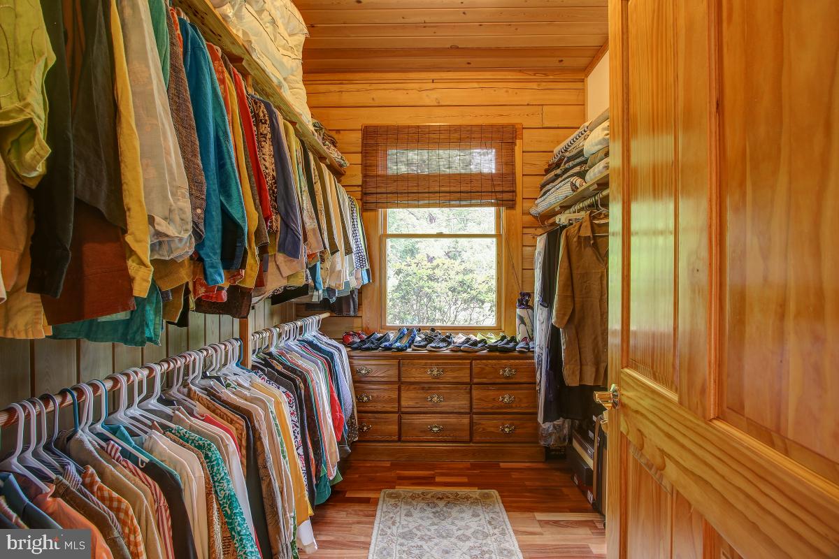 9626 Sherburne Farm Road Marshall, VA 20115 - Photo 10 of 57 a view of walk in closet with clothes and shoes