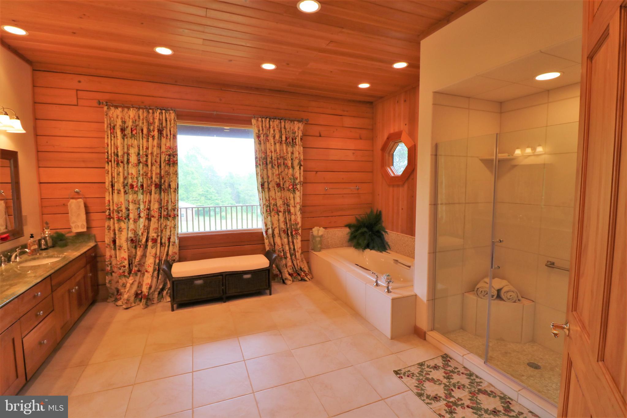 9626 Sherburne Farm Road Marshall, VA 20115 - Photo 26 of 57 a bathroom with a bathtub and a shower