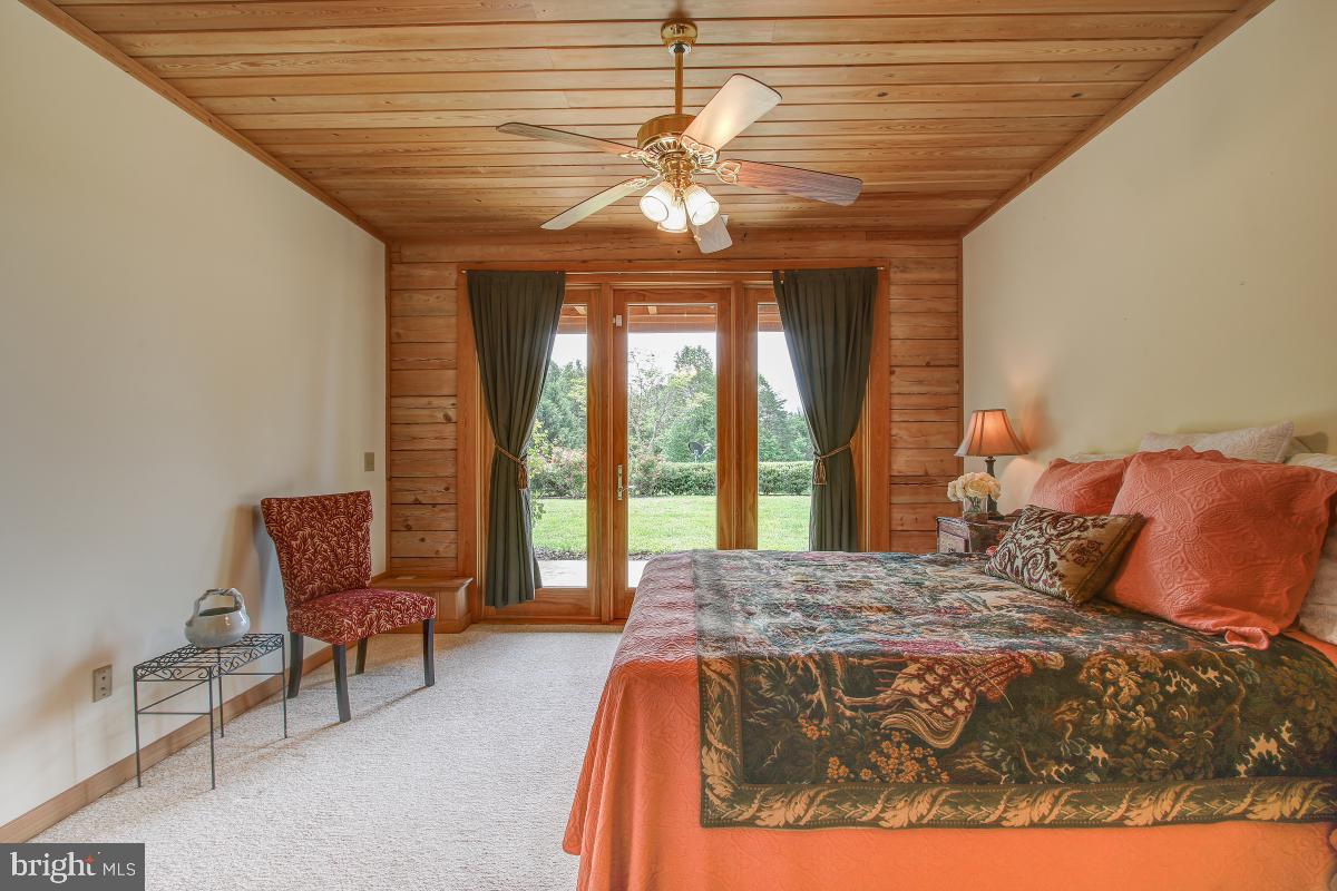 9626 Sherburne Farm Road Marshall, VA 20115 - Photo 34 of 57 a bedroom with a bed chairs and a desk