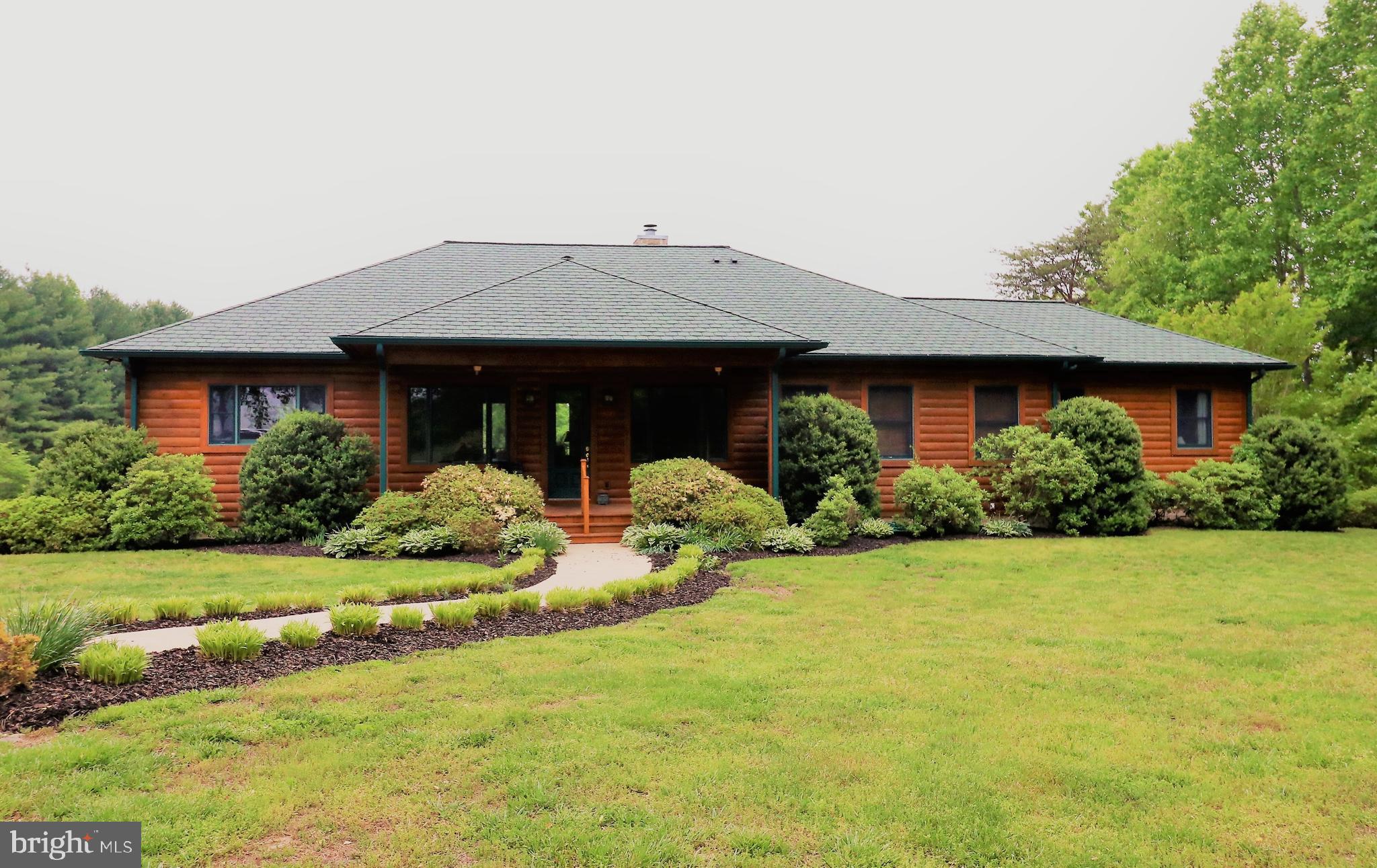 9626 Sherburne Farm Road Marshall, VA 20115 - Photo 45 of 57 a front view of a house with garden