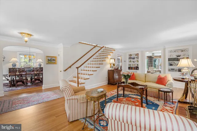 a living room with furniture a fireplace and a window