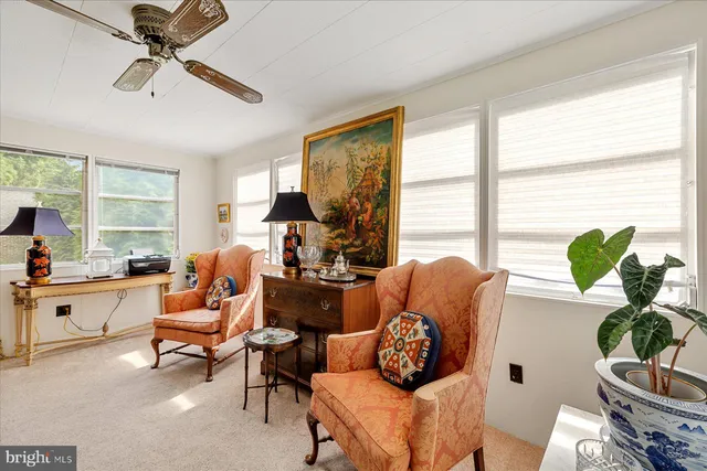 a living room with furniture or couch and a large window