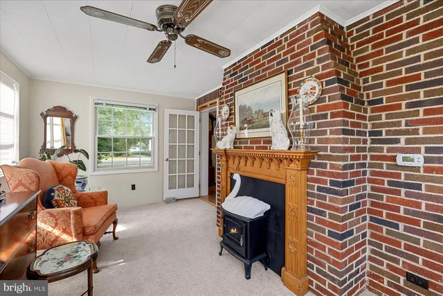 a living room with furniture a rug and a flat screen tv