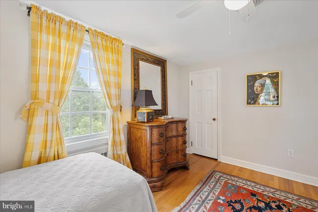 a view of yard with swimming pool and green space