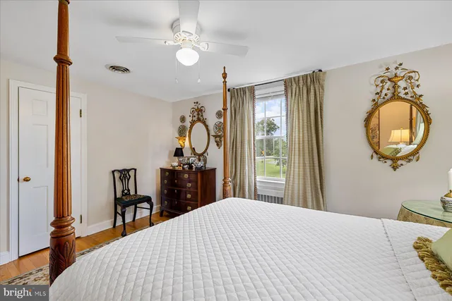 a front view of a house with swimming pool having outdoor seating