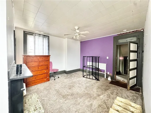 a bedroom with furniture and a window