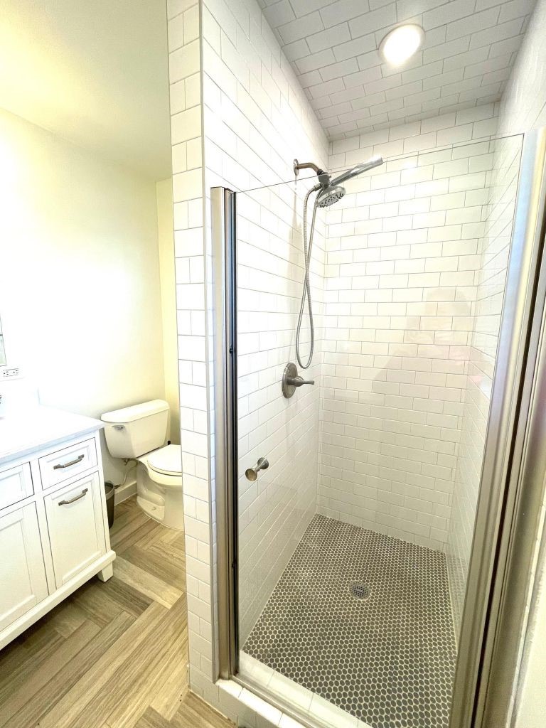 4334 Jefferson Street, Unit 1/2 Houston, TX 77023 - Photo 4 of 21 a bathroom with a shower and toilet