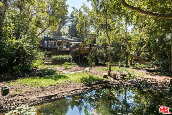 a outdoor space with chairs and wooden floor