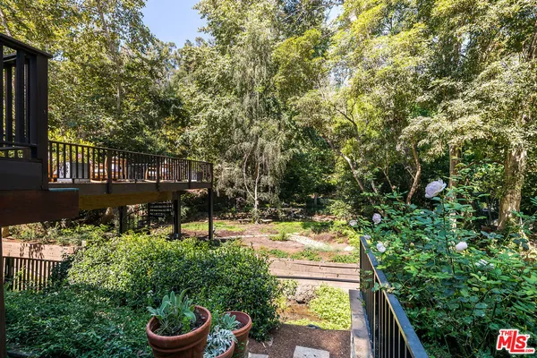 a view of a chair and table in the patio