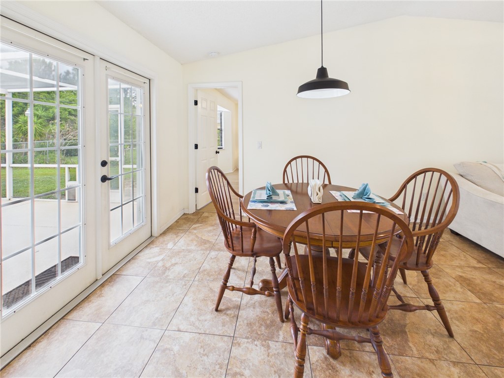 225 Midvale Terrace Sebastian, FL 32958 - Photo 7 of 25 a view of a dining room with furniture window and wooden floor