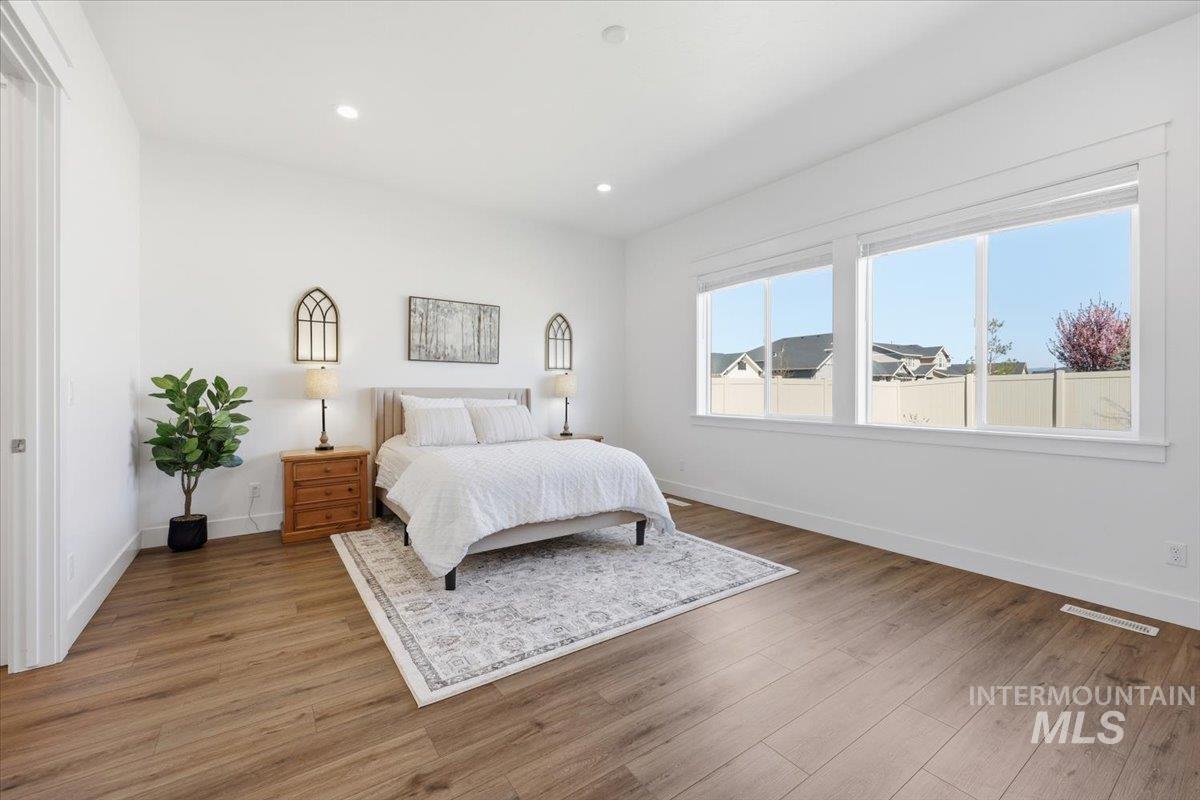5512 North Ebony Way Meridian, ID 83646 - Photo 18 of 40 Bedroom with wood finished floors and recessed lighting