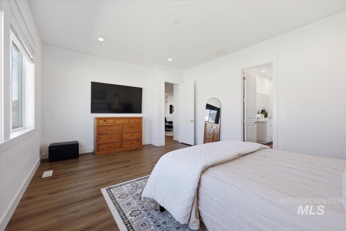 5512 North Ebony Way Meridian, ID 83646 - Photo 19 of 40 Bedroom featuring dark wood-style floors and recessed lighting