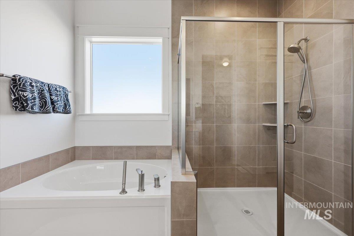 5512 North Ebony Way Meridian, ID 83646 - Photo 22 of 40 Full bathroom with a garden tub and a stall shower