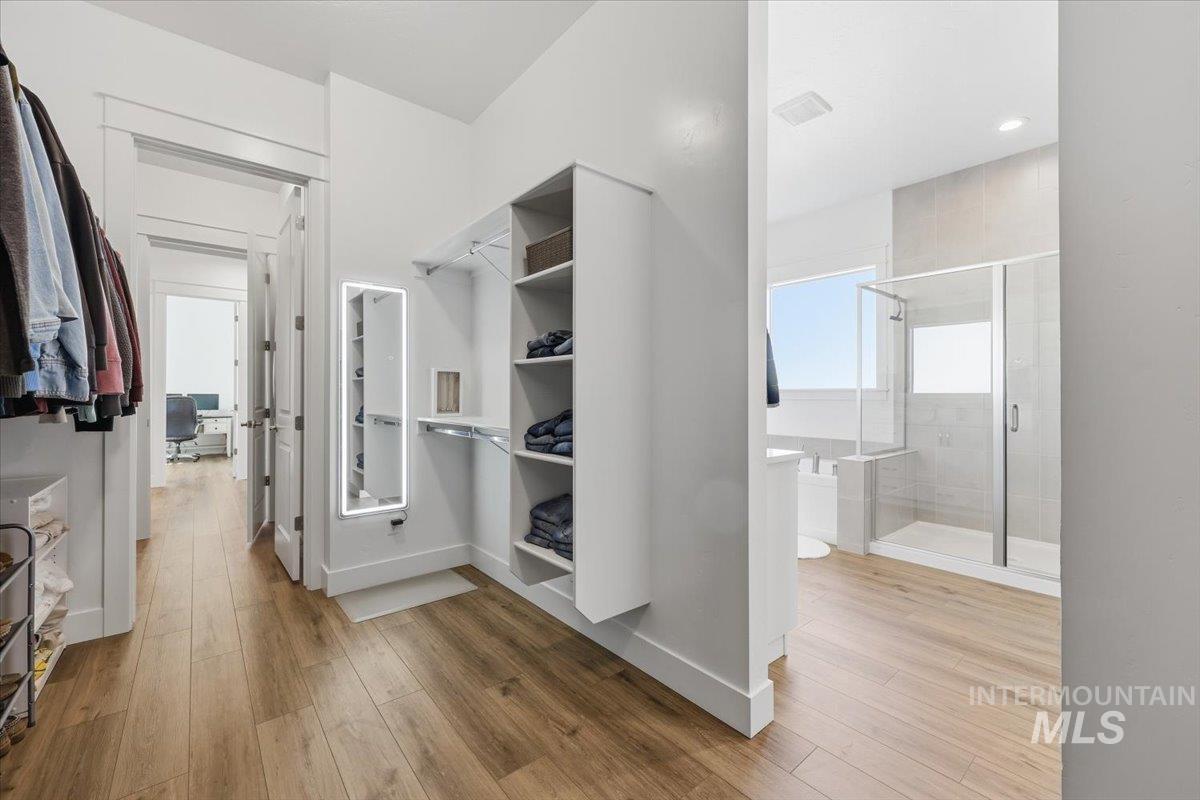 5512 North Ebony Way Meridian, ID 83646 - Photo 23 of 40 Walk in closet featuring light wood finished floors
