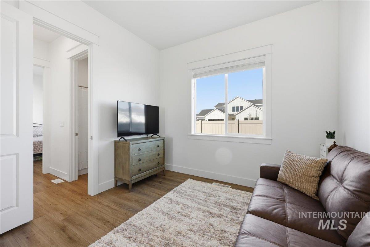 5512 North Ebony Way Meridian, ID 83646 - Photo 26 of 40 Bedroom with wood finished floors and baseboards