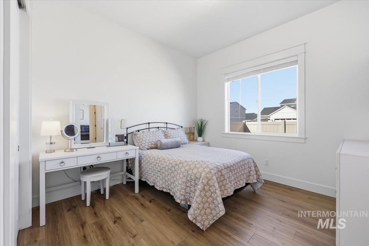 5512 North Ebony Way Meridian, ID 83646 - Photo 29 of 40 Bedroom with light wood-style floors