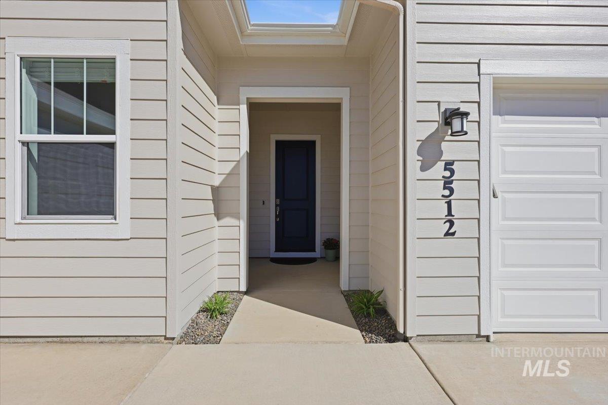 5512 North Ebony Way Meridian, ID 83646 - Photo 4 of 40 Entrance to property featuring a garage