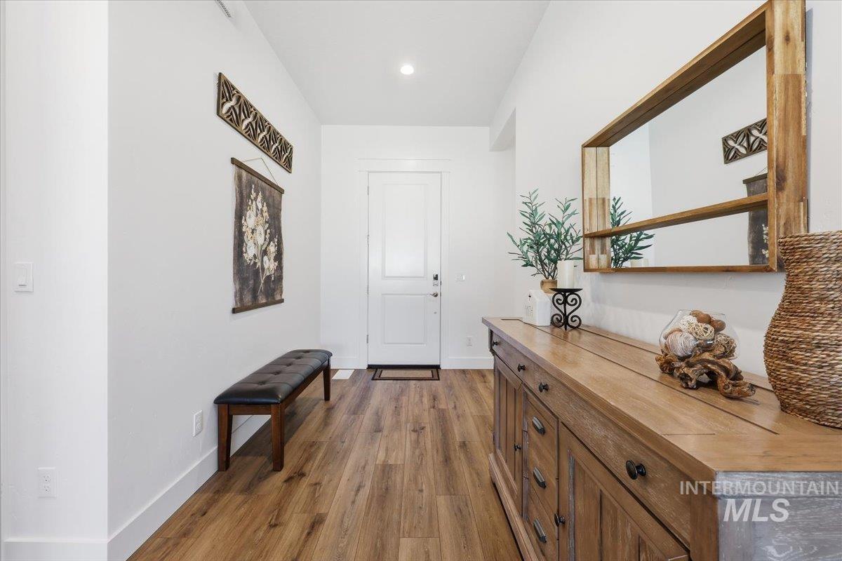 5512 North Ebony Way Meridian, ID 83646 - Photo 5 of 40 Entryway with dark wood-style flooring and recessed lighting