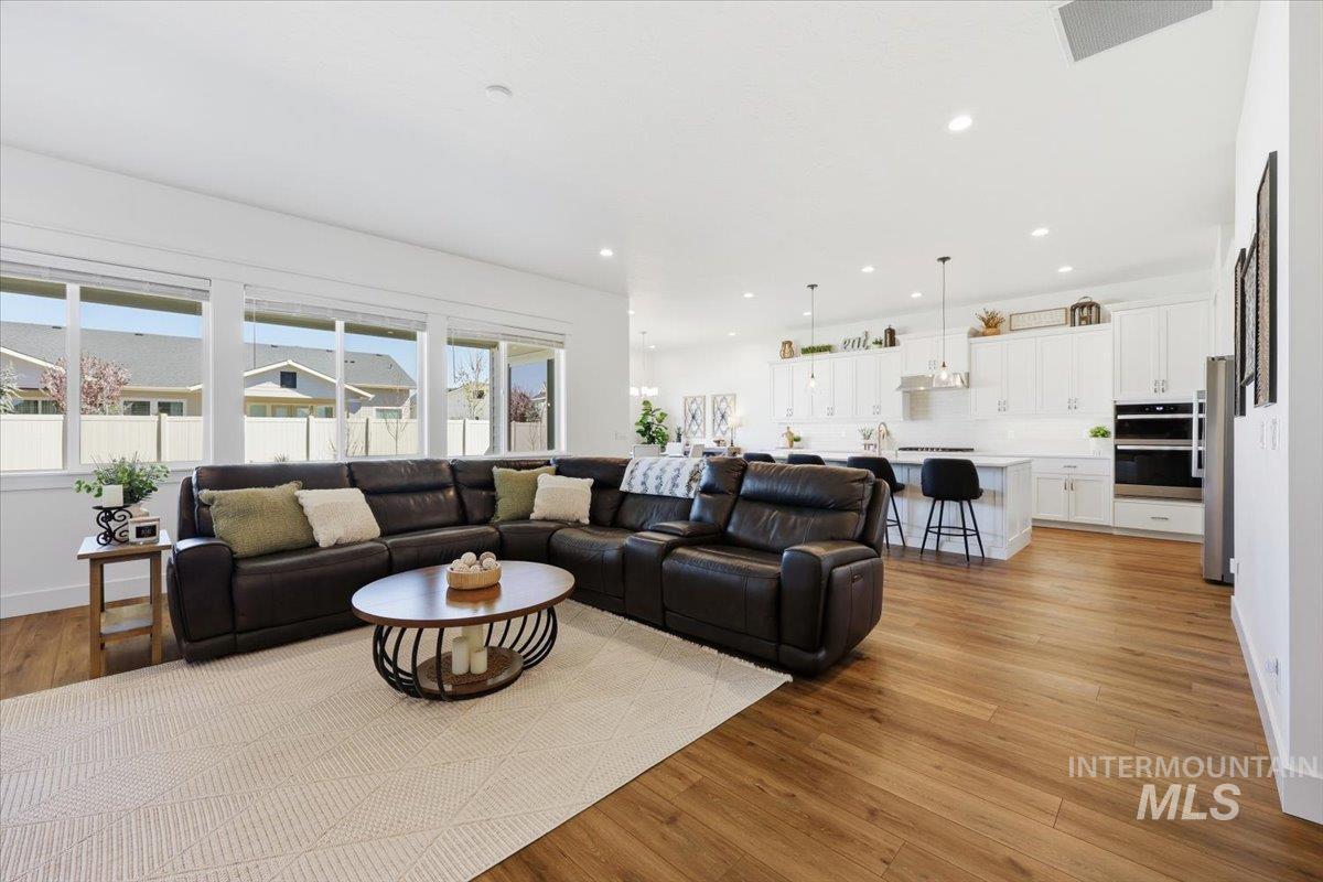 5512 North Ebony Way Meridian, ID 83646 - Photo 8 of 40 Living room featuring light wood-type flooring and recessed lighting