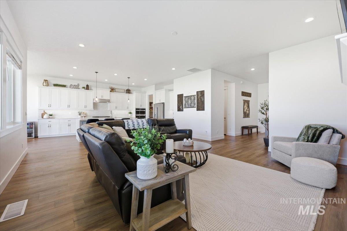 5512 North Ebony Way Meridian, ID 83646 - Photo 10 of 40 Living room featuring wood finished floors and recessed lighting