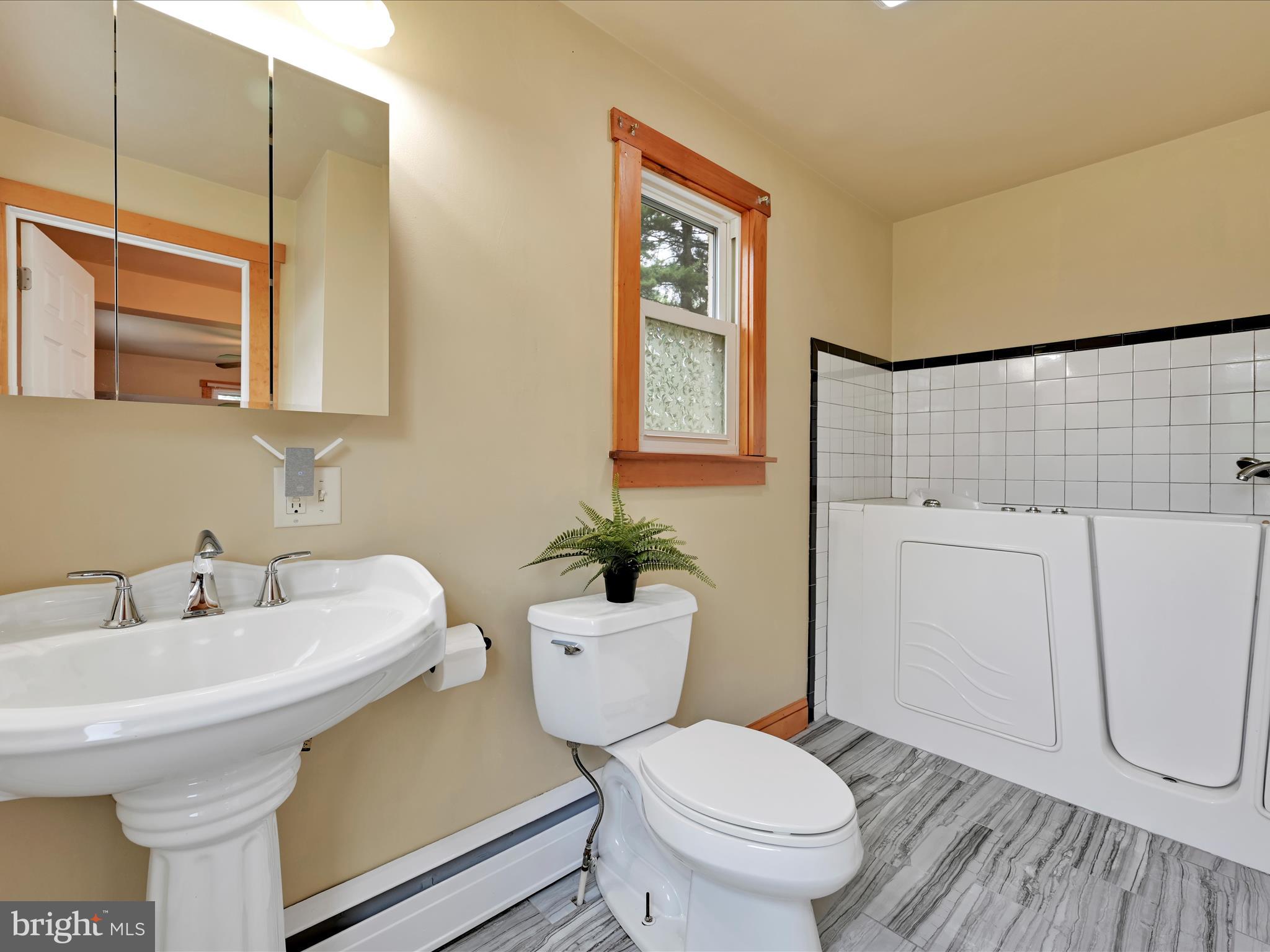 1553 St Peters Road Pottstown, PA 19465 - Photo 13 of 33 a bathroom with a sink a toilet and shower