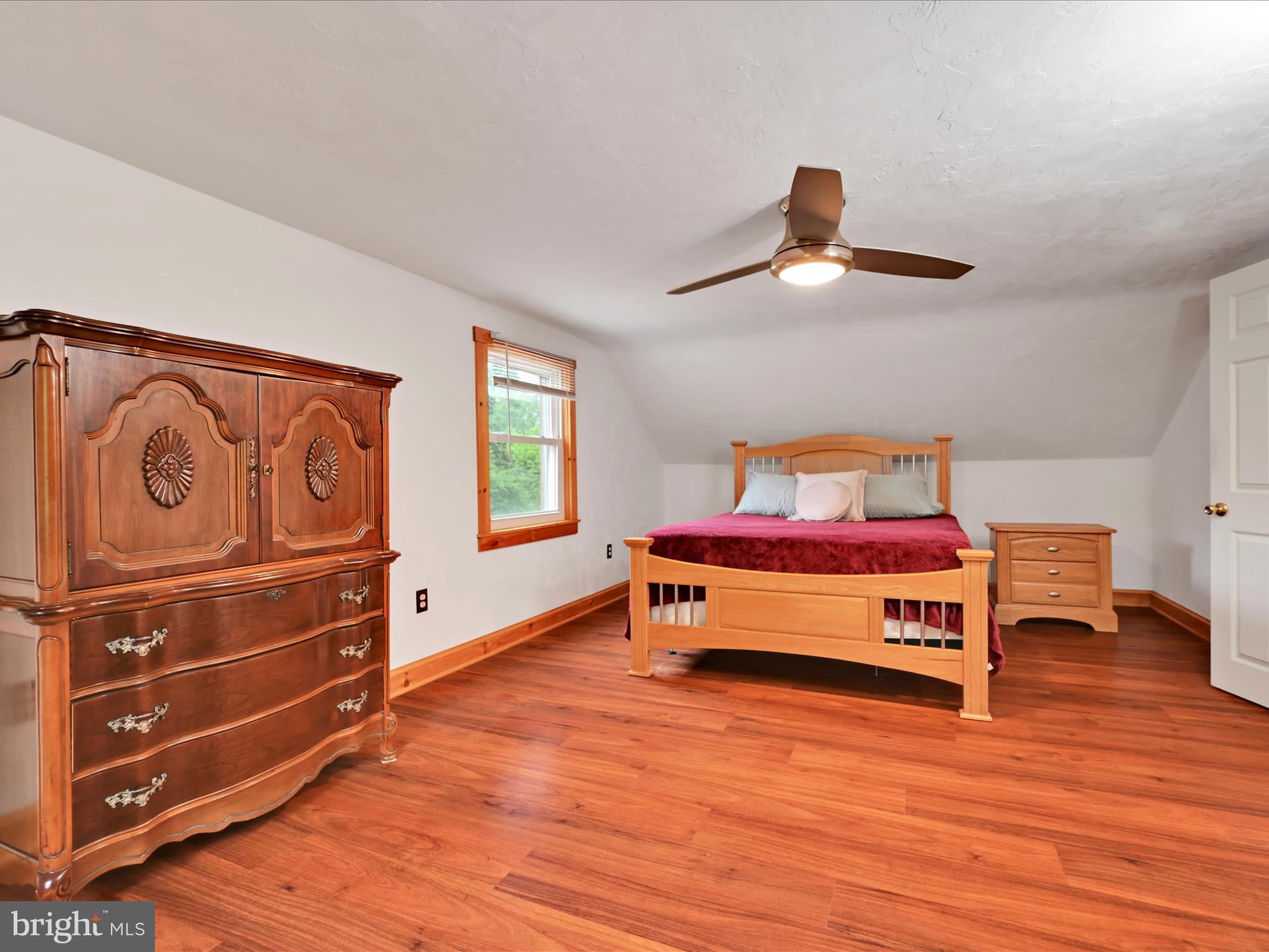 1553 St Peters Road Pottstown, PA 19465 - Photo 14 of 33 a bedroom with a bed and wooden floor