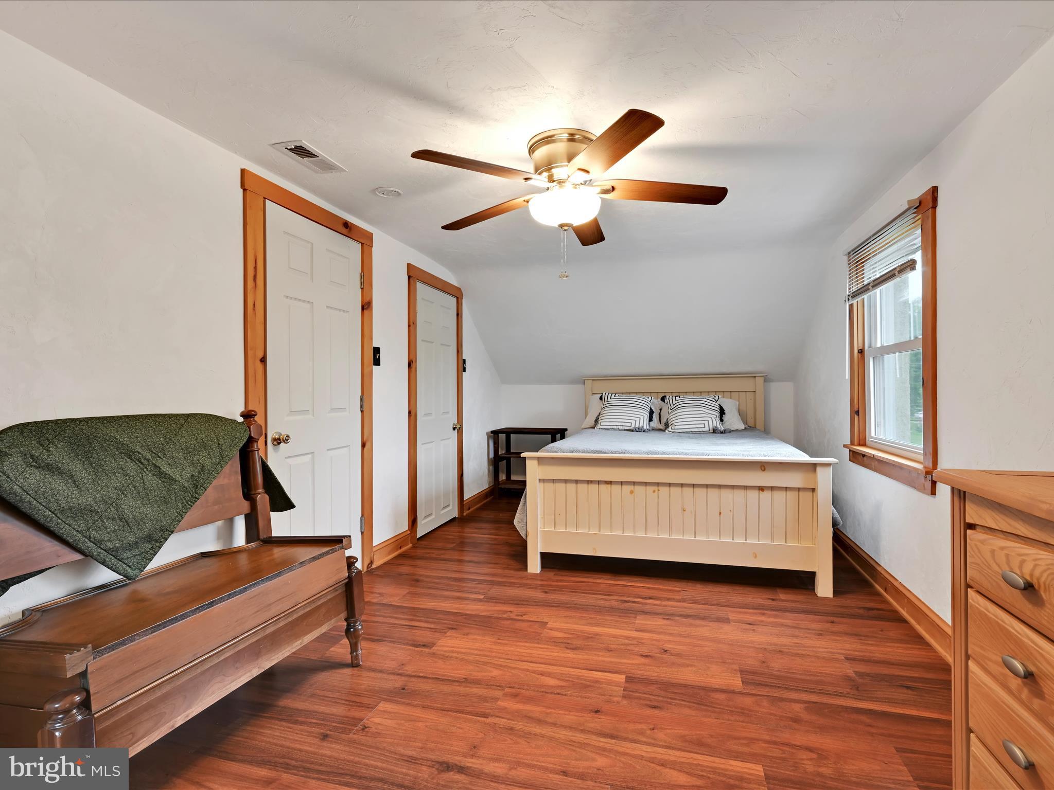 1553 St Peters Road Pottstown, PA 19465 - Photo 15 of 33 a bedroom with a bed and a chandelier