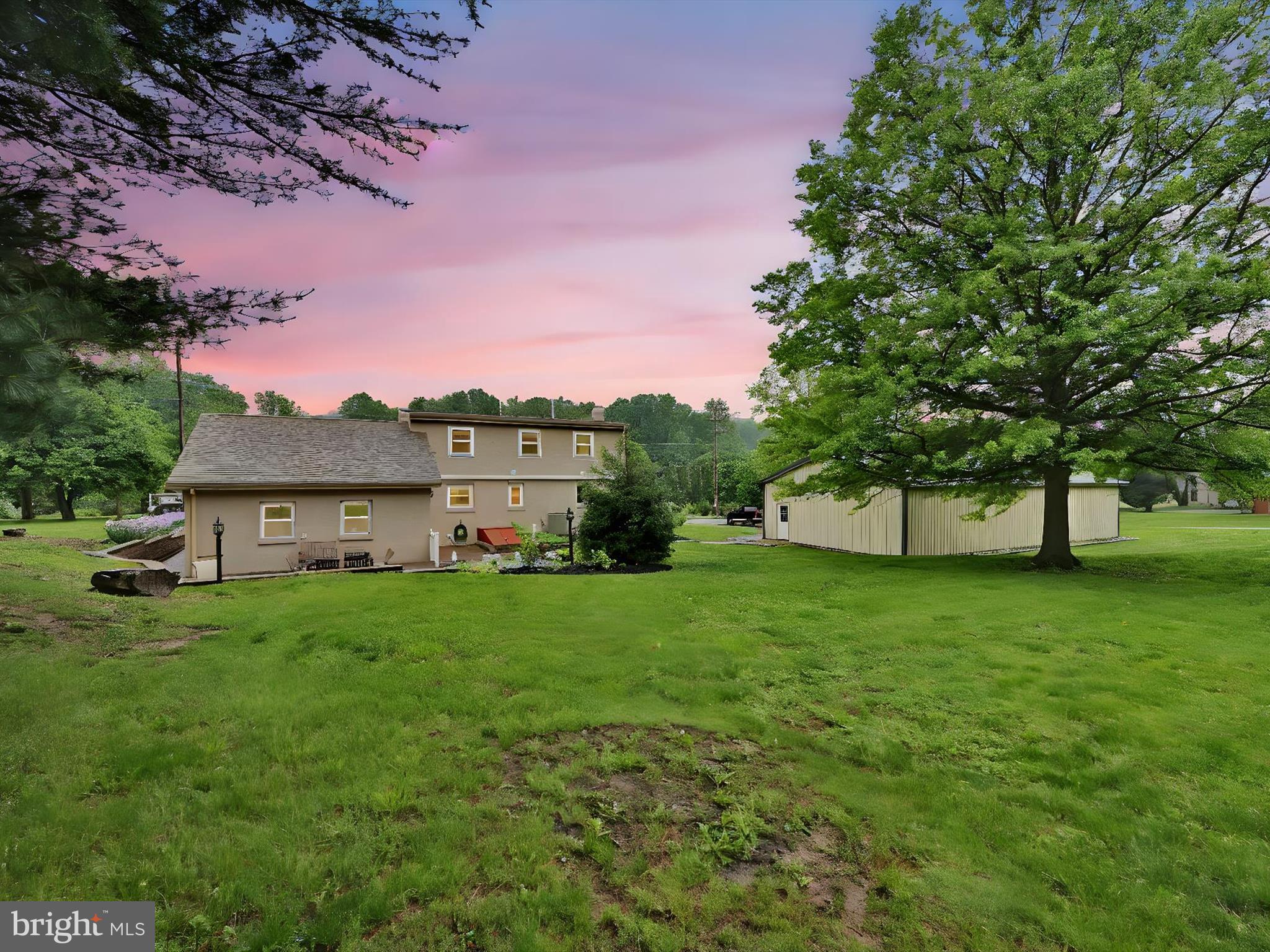 1553 St Peters Road Pottstown, PA 19465 - Photo 21 of 33 a view of a house with a big yard potted plants and large tree