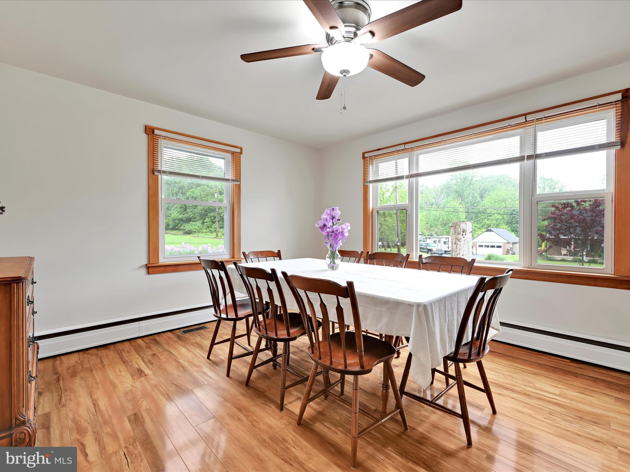 1553 St Peters Road Pottstown, PA 19465 - Photo 6 of 33 a view of a dining room with furniture window and wooden floor