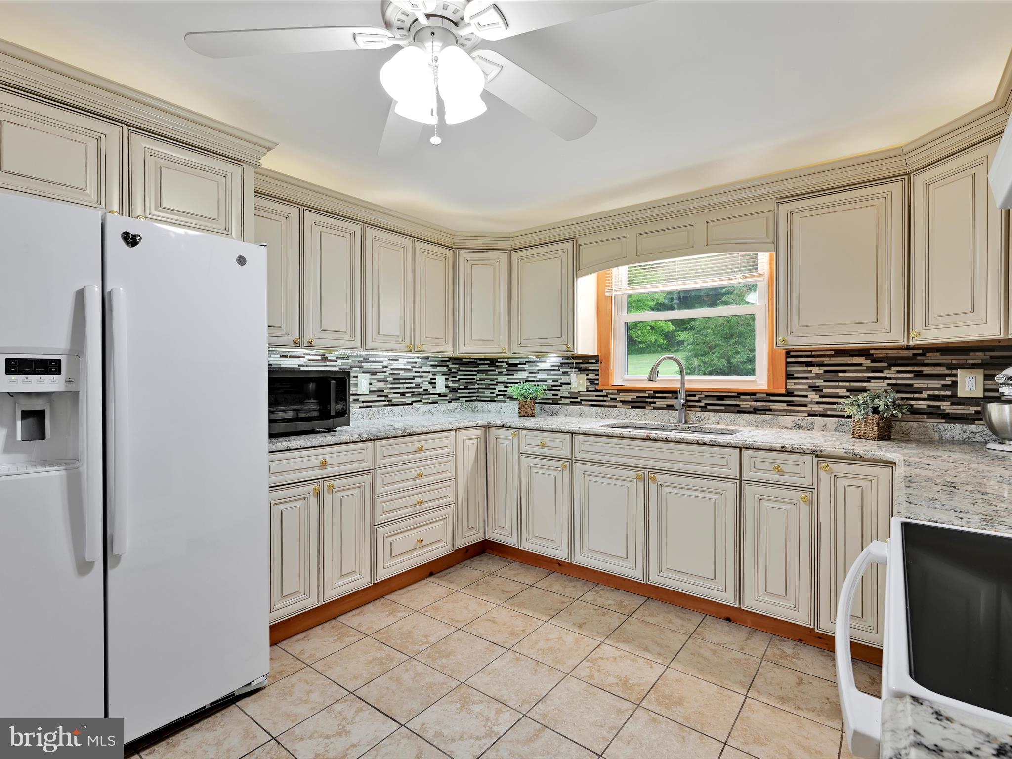 1553 St Peters Road Pottstown, PA 19465 - Photo 7 of 33 a kitchen with white cabinets and white appliances