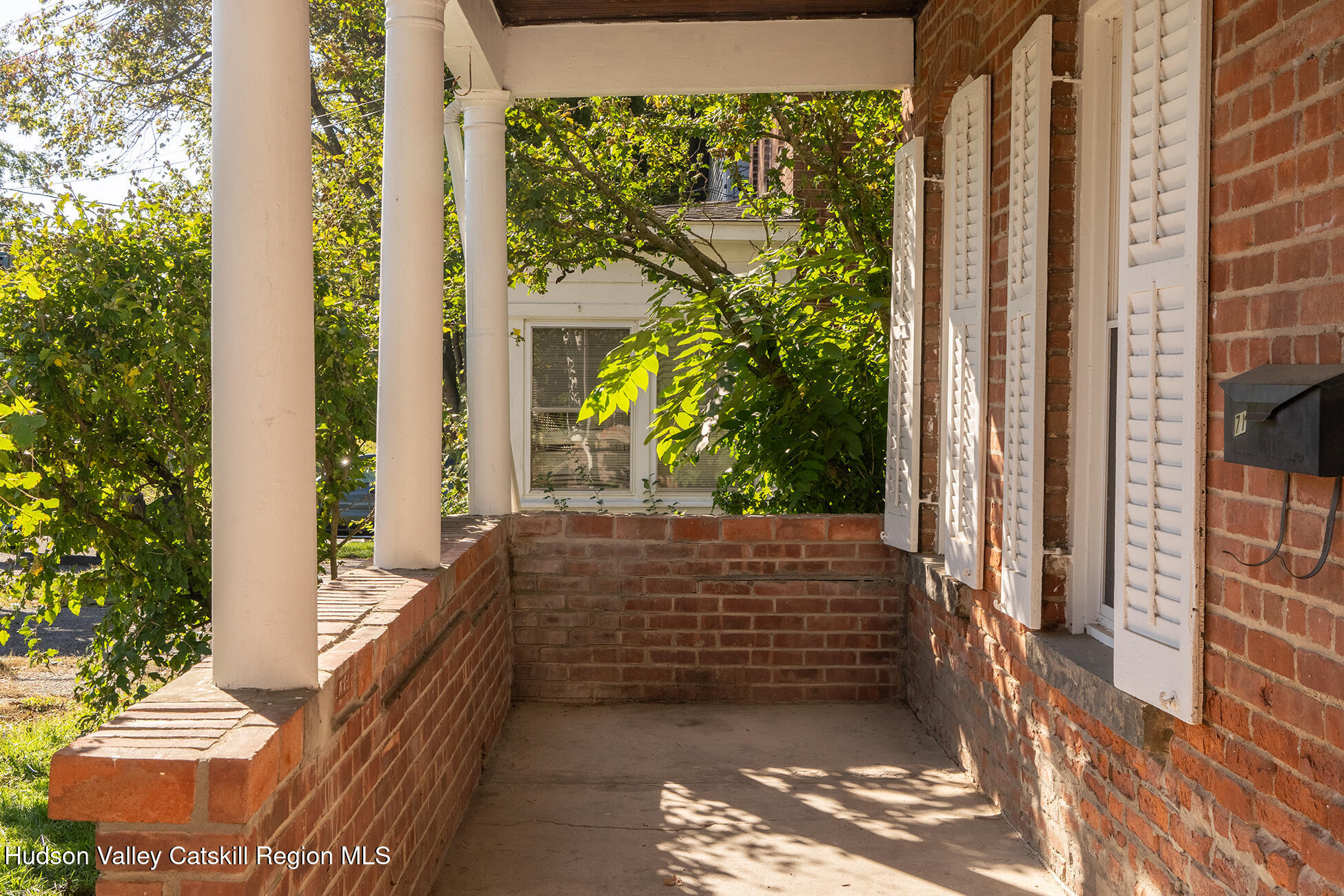 71 New Street Catskill, NY 12414 - Photo 2 of 13 a view of front door of house with a potted plant