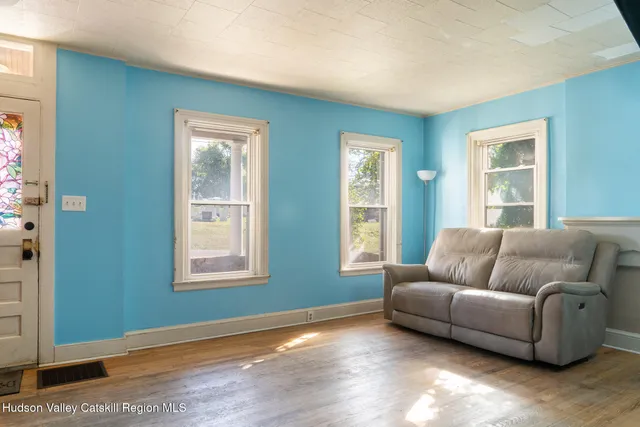 a living room with furniture and windows