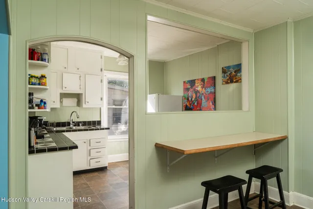 a kitchen with stainless steel appliances a stove a sink and a refrigerator