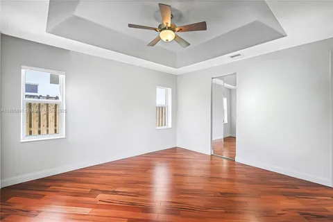 a bathroom with a sink mirror vanity and toilet