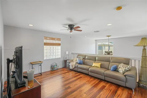 a view of wooden floor and windows in a room
