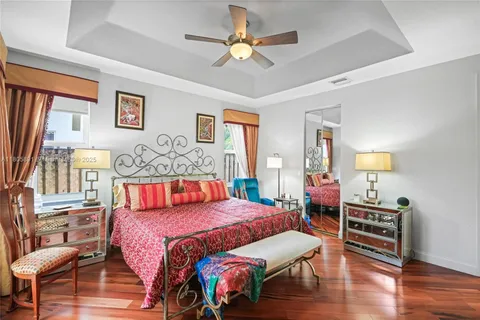 a living room with lots of furniture and view of kitchen