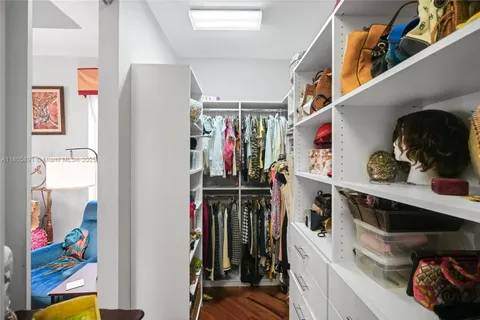 a view of a dining room with furniture wooden floor and chandelier