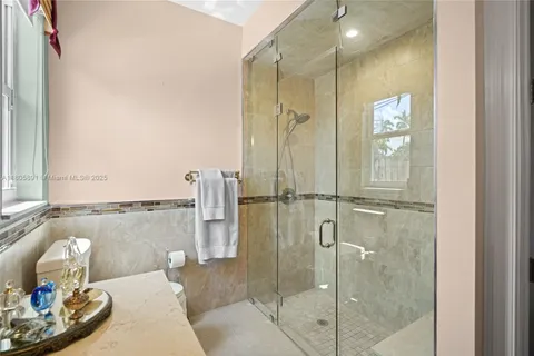 a kitchen with stainless steel appliances granite countertop wooden cabinets a sink and a dishwasher